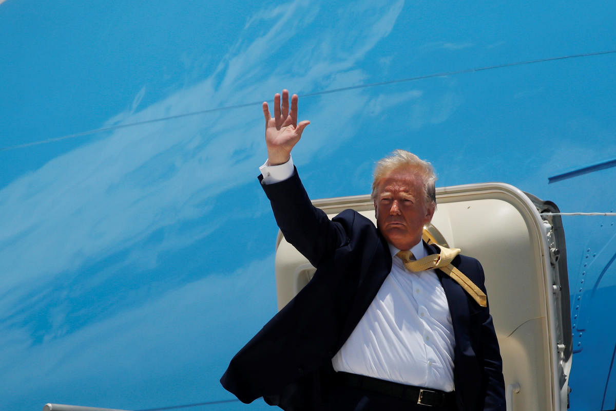 U.S. President Donald Trump waves while boarding Air Force One as he departs Miami International Airport for return travel to Washington, DC in Miami, Florida, U.S., June 19, 2019. REUTERS/Carlos Barria