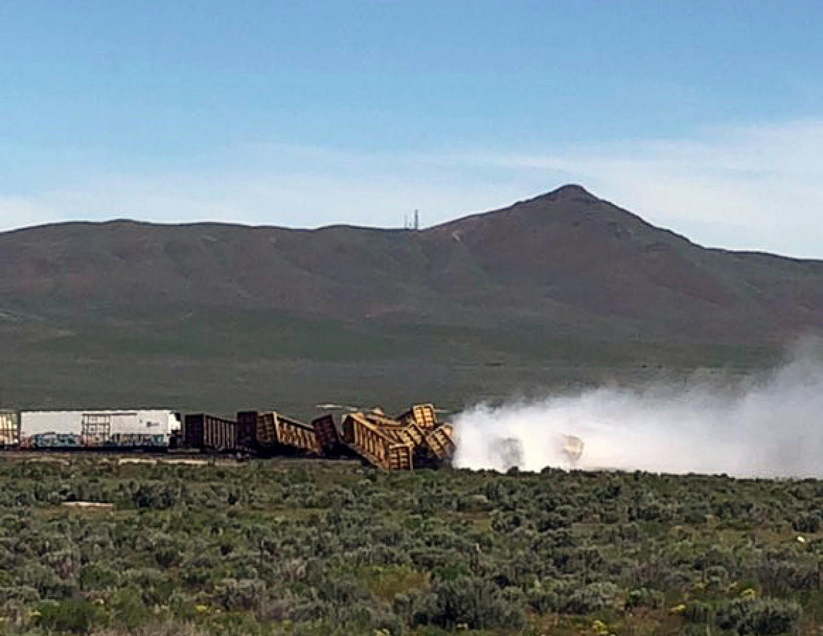 Smoke rises from overturned train wagons after an accident near Wells, Nevada, U.S., June 19, 2019, 2019 in this picture obtained from social media. Twitter/Michael Lyday/via REUTERS