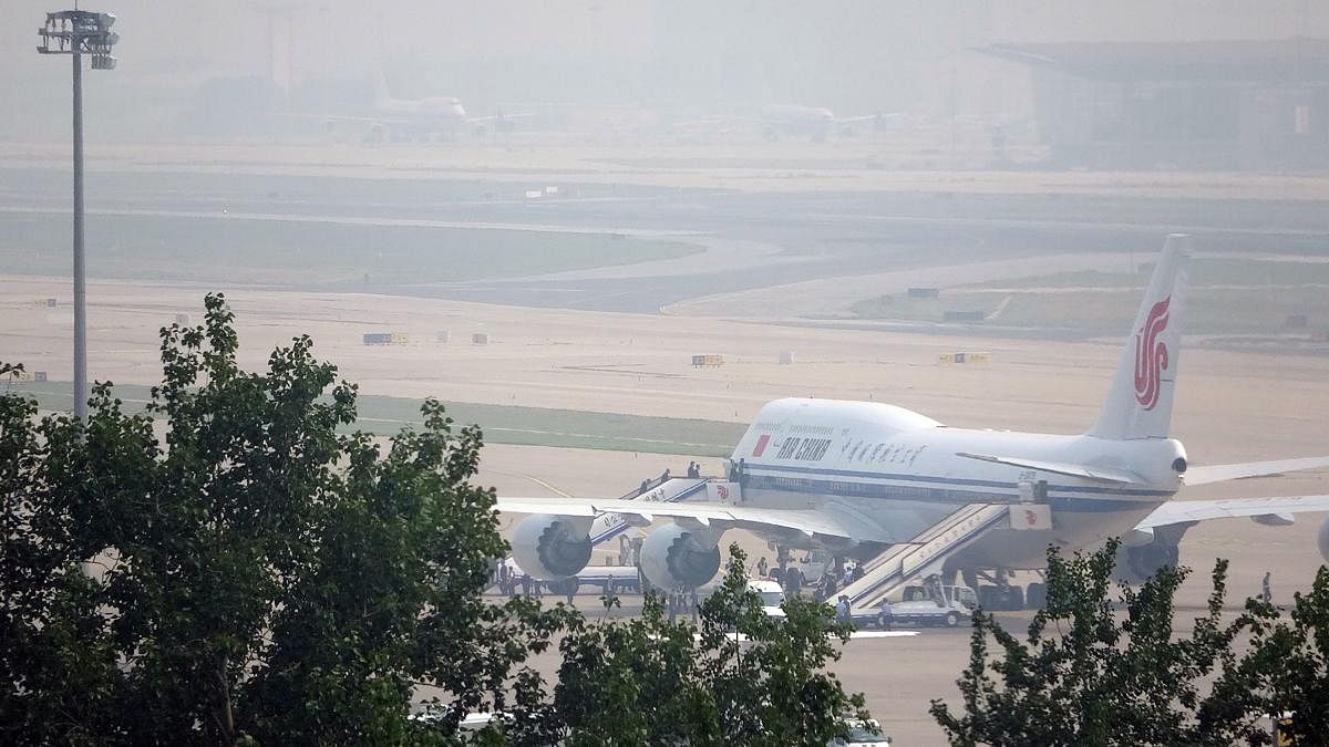 An Air China plane believed to be transporting Chinese President Xi Jinping to Pyongyang is parked on the tarmac at Beijing airport on June 20, 2019. (YONHAP / AFP)
