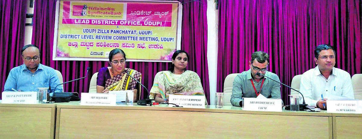 Zilla Panchayat Chief Executive Officer Sindhu Rupesh addresses officials at a quarterly meeting of district-level review committee for banking at Zilla Panchayat Hall in Udupi on Thursday.