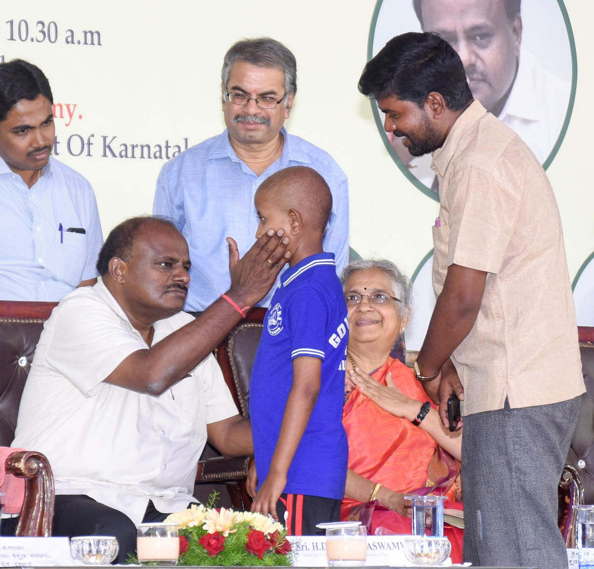 Chief Minister H D Kumaraswamy talks to a cancer patient. Infosys Foundation chairperson Sudha Murty is also seen.