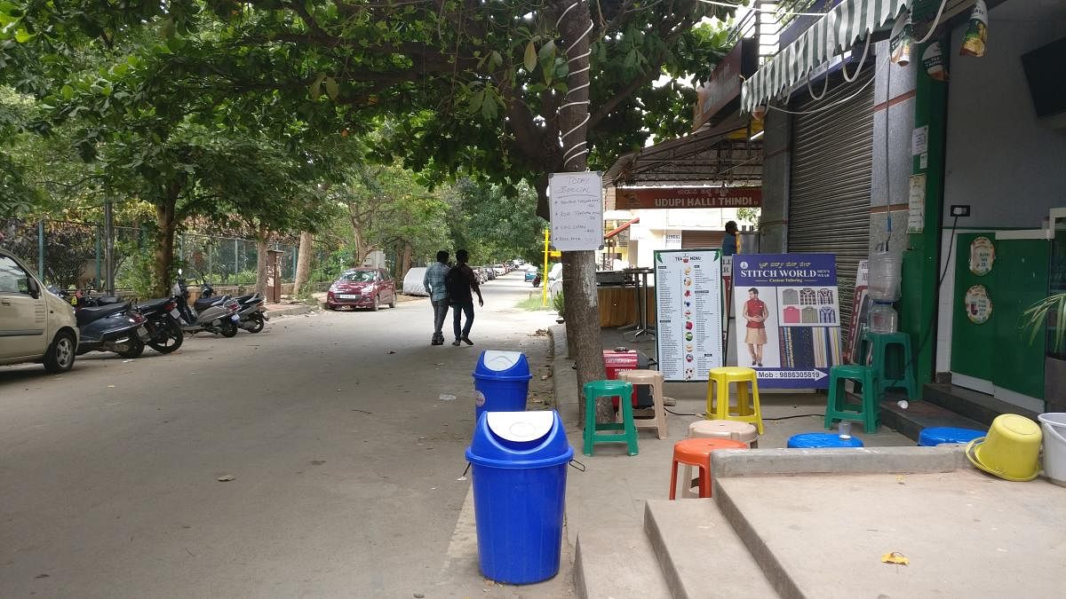 Roads in a neighbourhood in Kasturinagar occupied with furniture from an eatery.