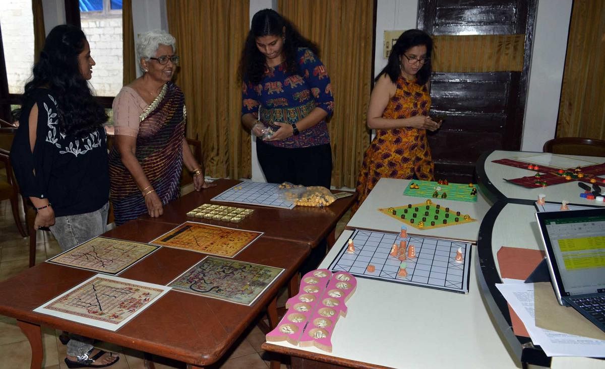 Visitors taking a look at various board games displayed at the first-ever national conference on ancient and medieval board games in Mumbai. DH Photo