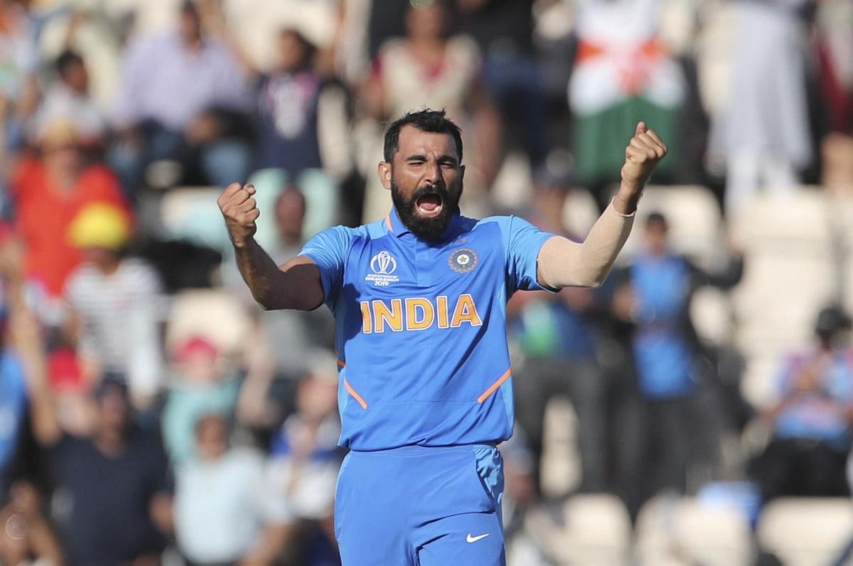 Mohammad Nabi nearly pulled it off for Afghanistan, but Mohammed Shami took a hat-trick to seal the game in the last over as the underdogs were bowled out for 213. (AP/PTI Photo)