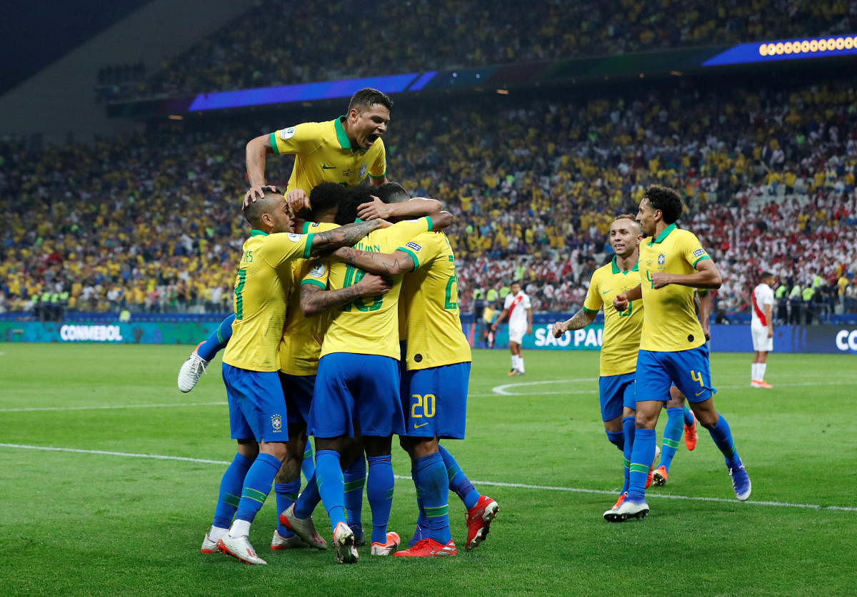 Goals from Casemiro, Roberto Firmino, Everton, Dani Alves and Willian ensured the Selecao would finish top of Group A. (Reuters Photo)