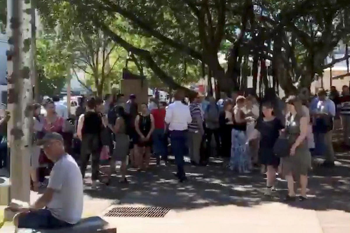 People gather outside during an earthquake evacuation near Darwin Entertainment Centre in Darwin, Australia, June 24, 2019, in this still image obtained via social media. Harriet Robinson/via REUTERS ATTENTION EDITORS - THIS IMAGE HAS BEEN SUPPLIED BY A T