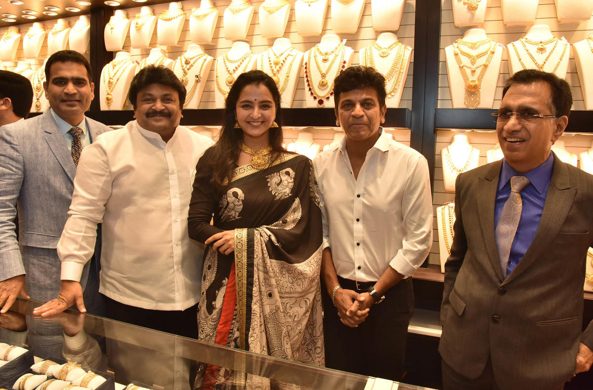 Film actors Shivrajkumar, Prabhu Ganesan and Chairman T S Kalyanaraman at the inauguration of Kalyan Jewellers showroom at Malleswara in Bengaluru on Friday. (DH Photo)