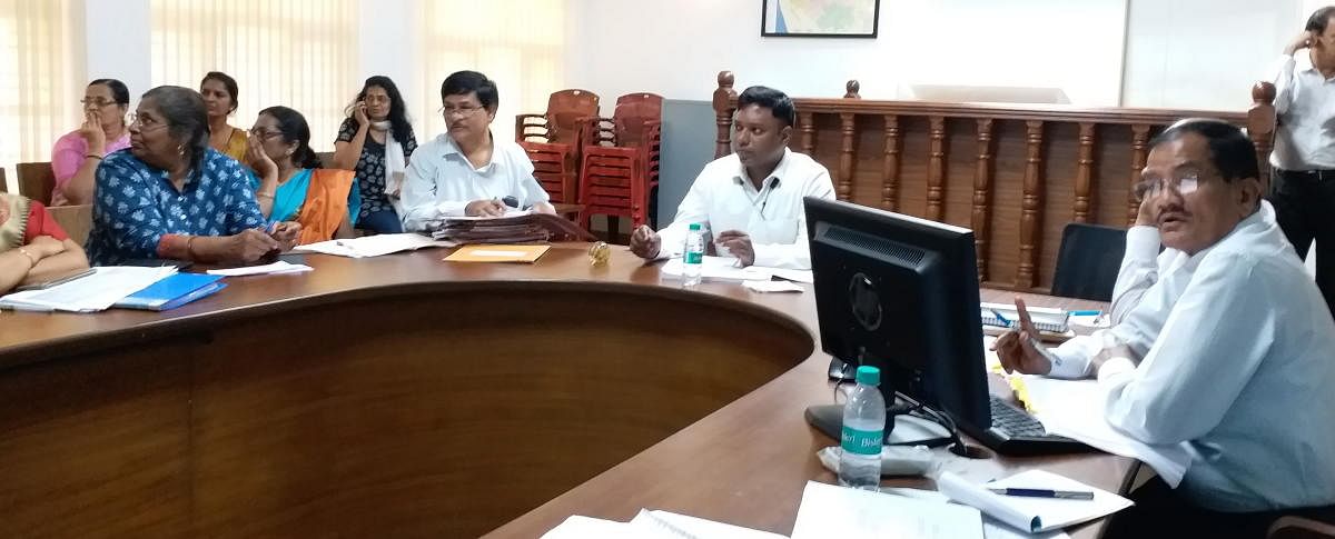 Deputy Commissioner Sasikanth Senthil chairs a meeting in Mangaluru on Monday.