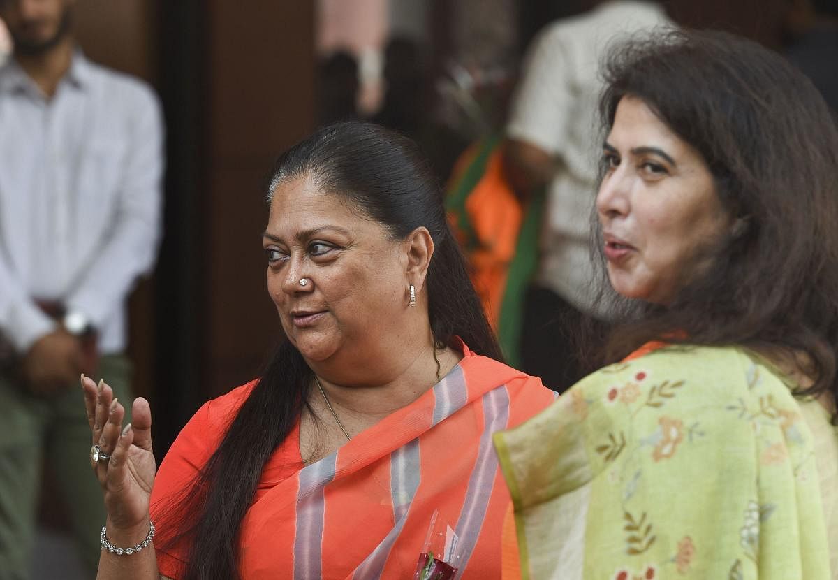 New Delhi: BJP leaders Vasundhara Raje and Saroj Pandey arrive for a meeting of party's national office bearers and state presidents presided by party President Amit Shah. (PTI Photo)