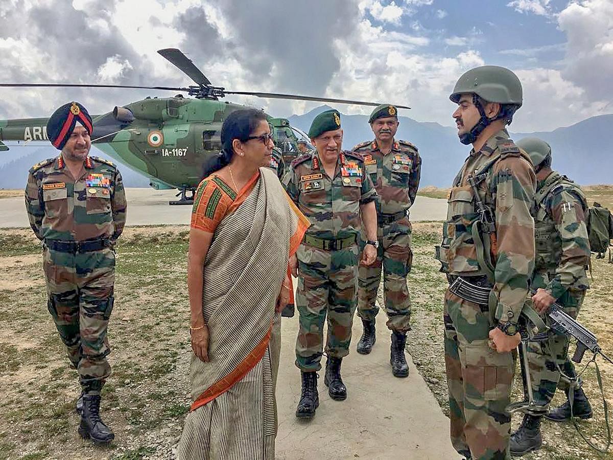 Defence Minister Nirmala Sitharaman with Army Chief Gen. Bipin Rawat interacts with troops of the 28 Inf Div on their visit to the Balbir forward post in Keran sector, J &amp; K on Sunday, Sept 2, 2018. (Defence Minister Twitter via PTI)
