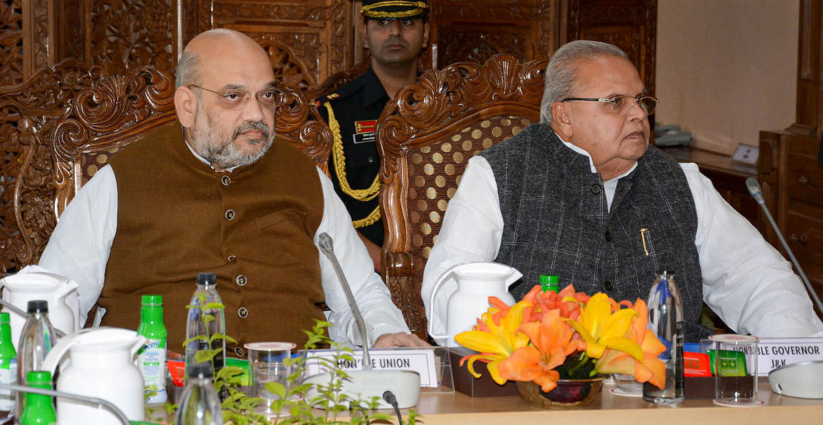 Union Home Minister Amit Shah chairs a meeting to review the security arrangements for the annual Amarnath Yatra, in Srinagar, Thursday, June 27, 2019. Jammu and Kashmir Governor Satya Pal Malik is also seen. (PTI Photo)