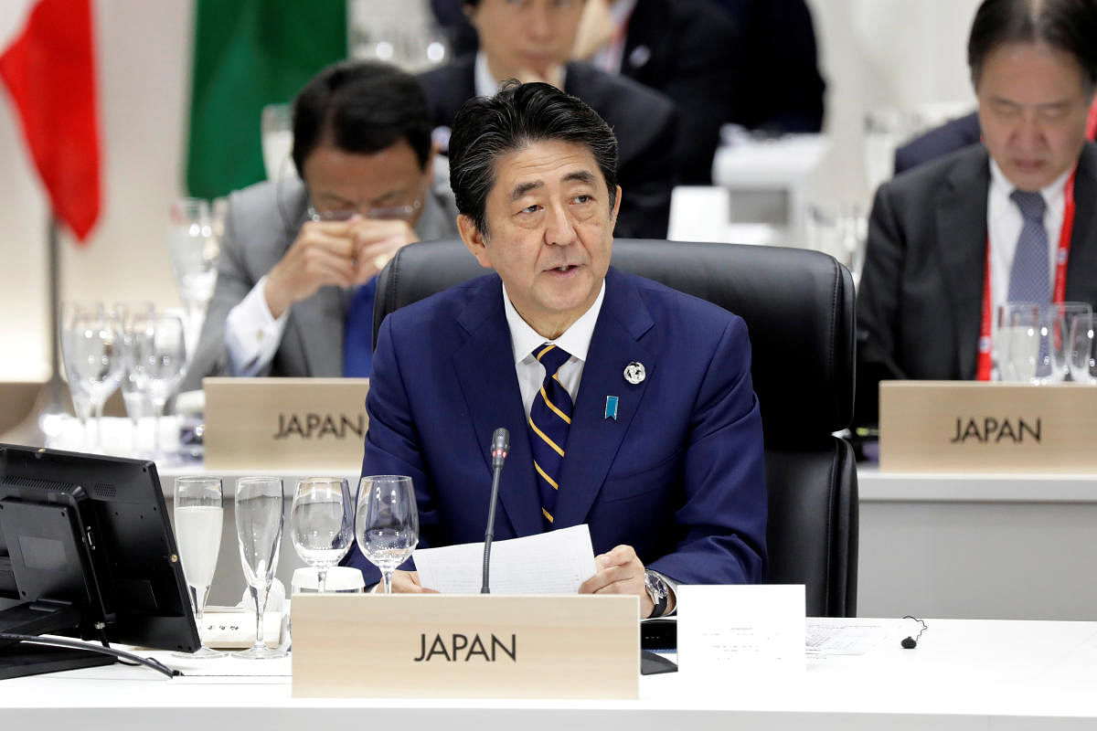 Japan's Prime Minister Shinzo Abe speaks during a working lunch at the Group of 20 (G-20) summit in Osaka, Japan, on Friday, June 28, 2019. Kiyoshi Ota/Pool via REUTERS