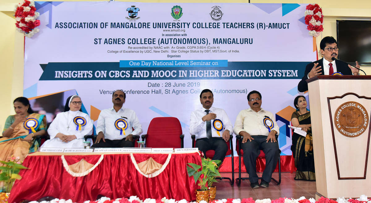Mangalore University Vice Chancellor Prof P S Yadapadithaya speaks at the national-level seminar on ‘Insights on CBCS and MOOC in Higher Education System’ organised by Amuct and St Agnes College, in Mangaluru on Friday.