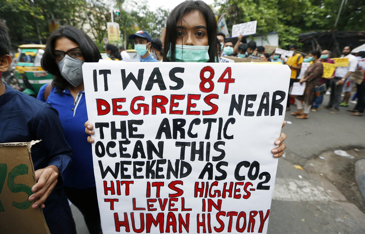 Participants hold placards as they take part in a protest march demanding urgent measures to combat climate change, in Kolkata, India, June 7, 2019. REUTERS/Rupak De Chowdhuri