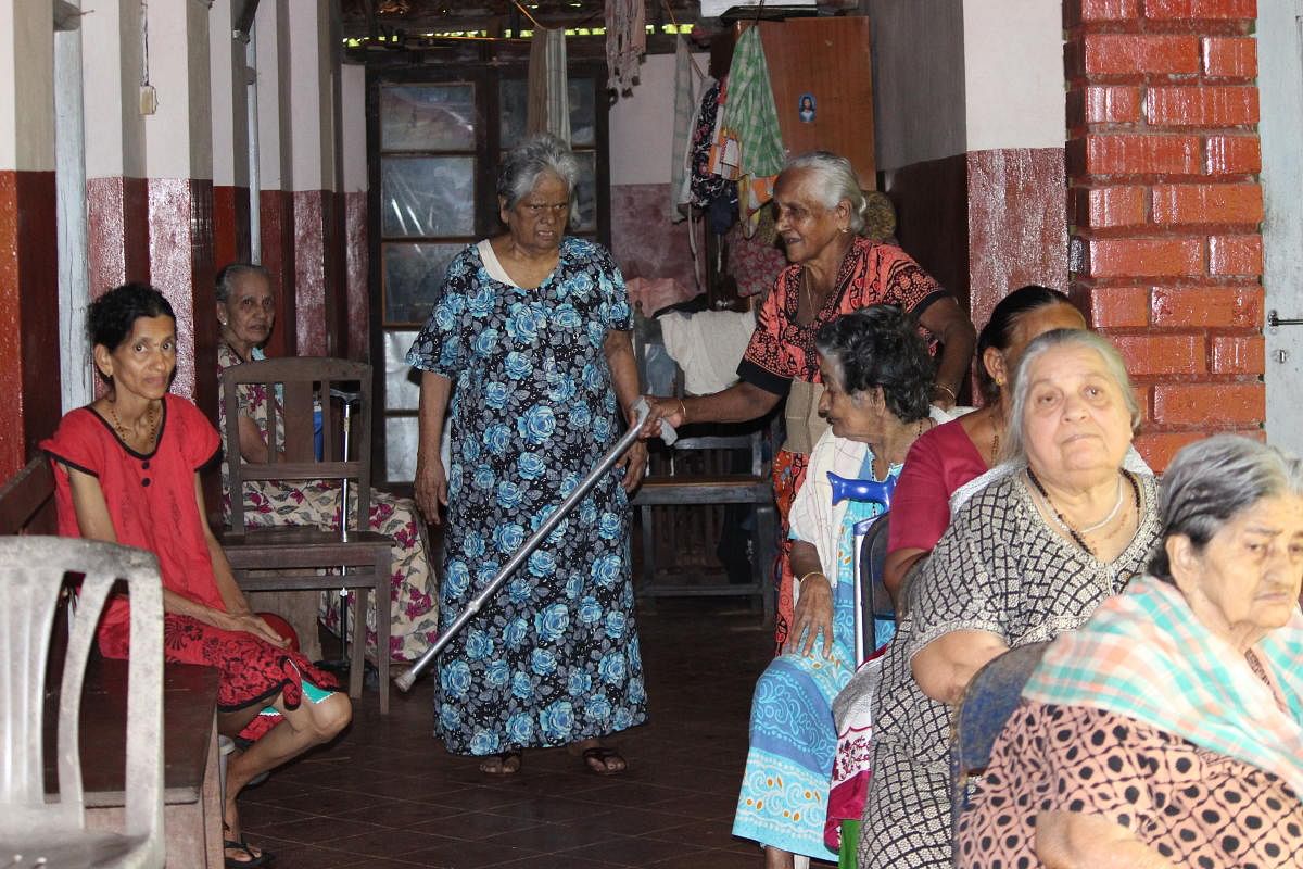Residents of Mount Rosary Home in Moodbidri engaged in indoor and outdoor activities.