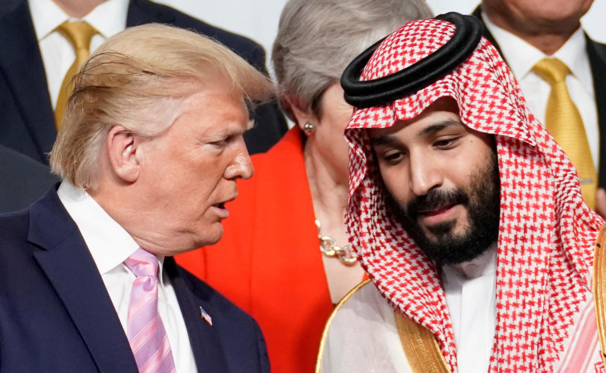 U.S. President Donald Trump speaks with Saudi Arabia's Crown Prince Mohammed bin Salman during family photo session with other leaders and attendees at the G20 leaders summit in Osaka, Japan, June 28, 2019. (REUTERS)