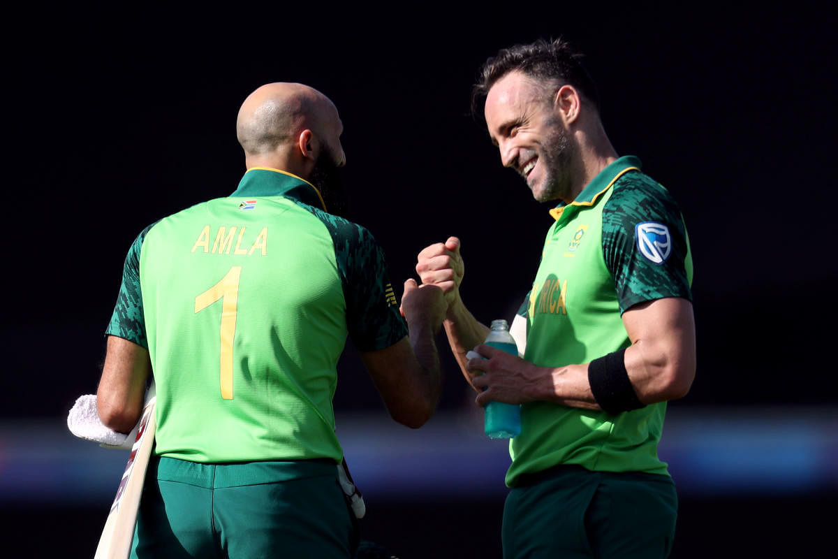 South Africa's Hashim Amla and Faf du Plessis celebrate following a review. (Reuters)