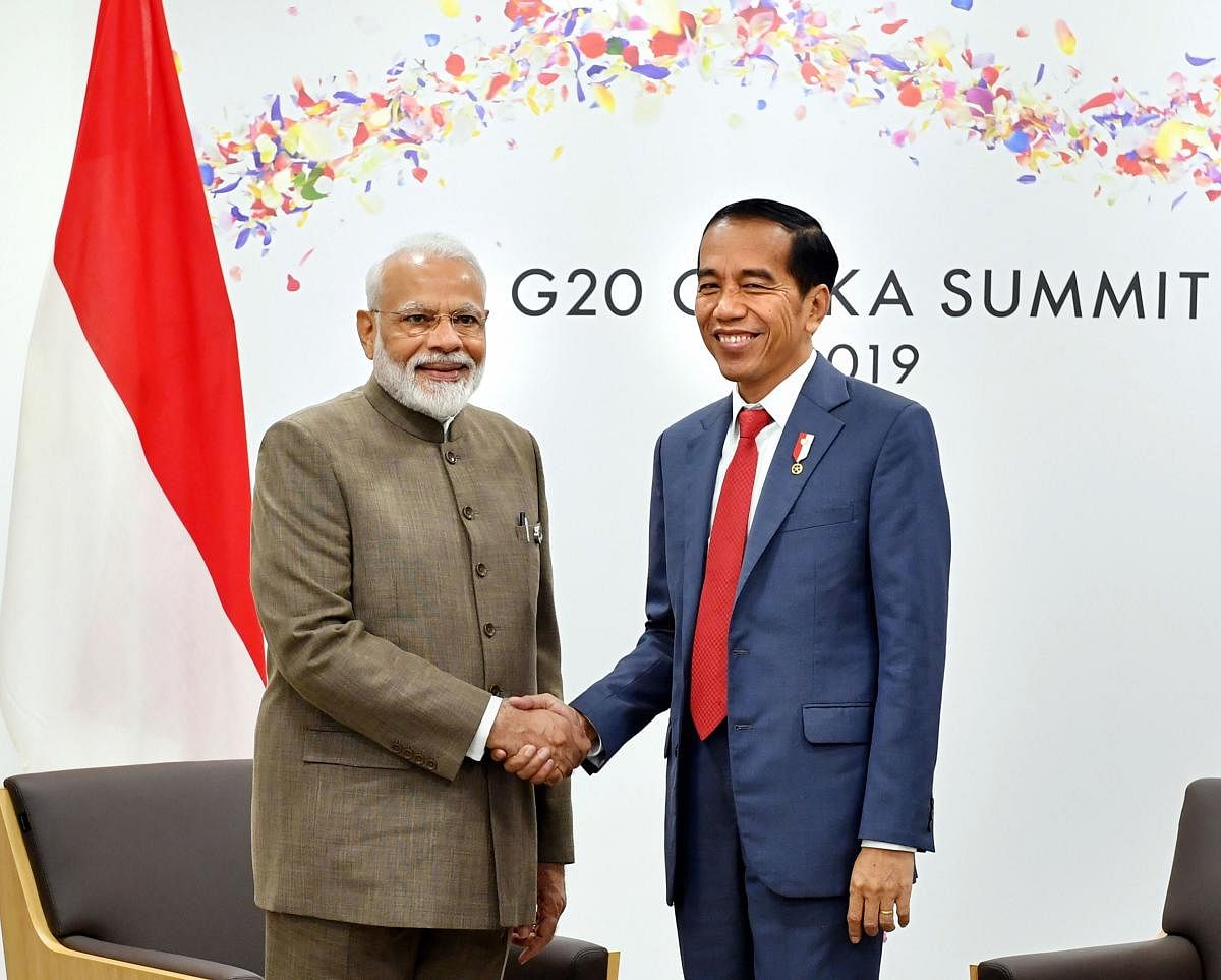 Prime Minister Narendra Modi meets the President of Indonesia Joko Widodo, on the sidelines of the G-20 Summit, in Osaka, Japan. (PTI Photo)
