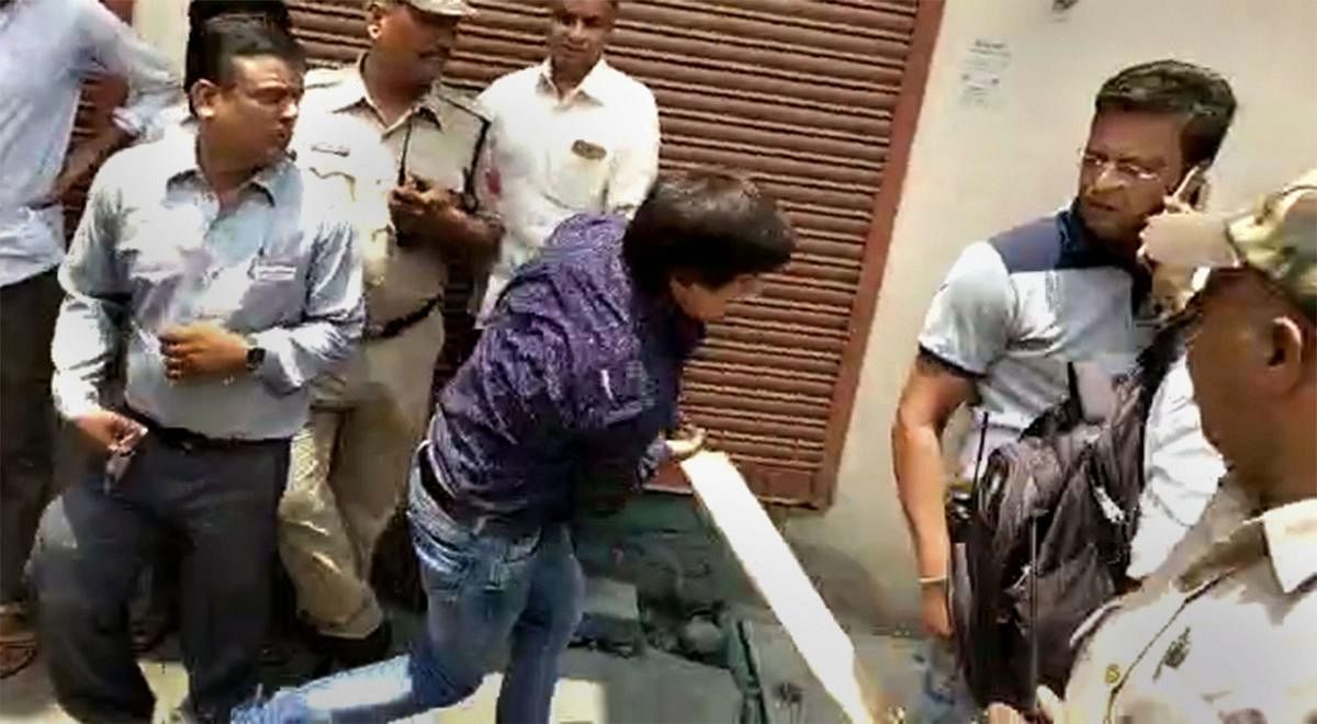 In this video still BJP MLA Akash Vijayvargiya is seen assaulting a civic official with a cricket bat in Indore, Wednesday, June 26, 2019.