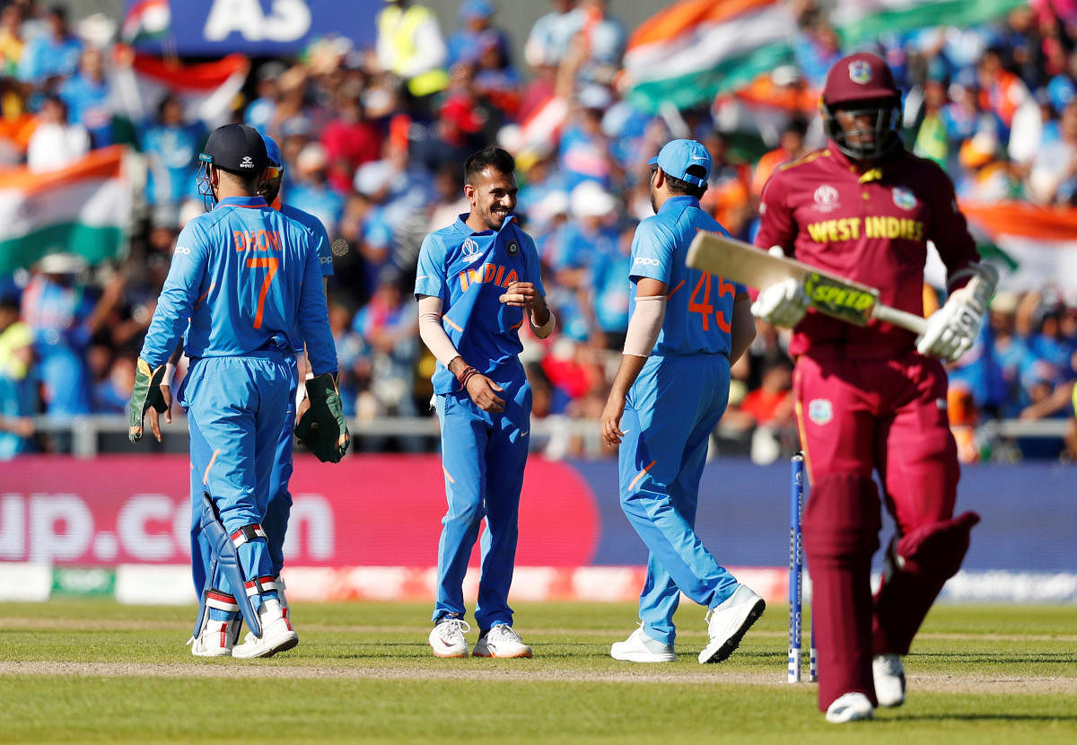 Cricket - ICC Cricket World Cup - West Indies v India - Old Trafford, Manchester, Britain - June 27, 2019 India's Yuzvendra Chahal celebrates with team mates after dismissing West Indies' Sheldon Cottrell with an LBW Action Images via Reuters/Lee Smith