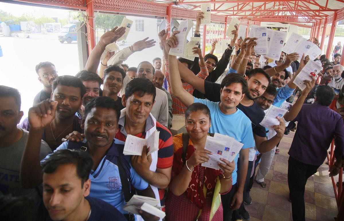 Jammu: People show their registration slip for Amarnath Yatra, at a base camp in Jammu, Saturday, June 29, 2019. PTI