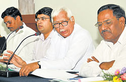 brain-storming: Chairman of the Third State Finance Commission Implementation Task Force, A G Kodgi, member of the task force Thimmegowda, CEO of Zilla Panchayat Ajay Nagabushan at a meeting held in zilla panchayat premises, here on&#8200;Tuesday. DH Photo