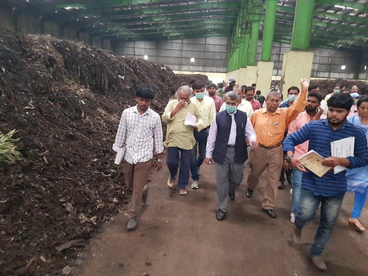 Members of the NGT's state-level committee at the waste plant in Chikkanagamangala on Sunday. SPECIAL ARRANGEMENT