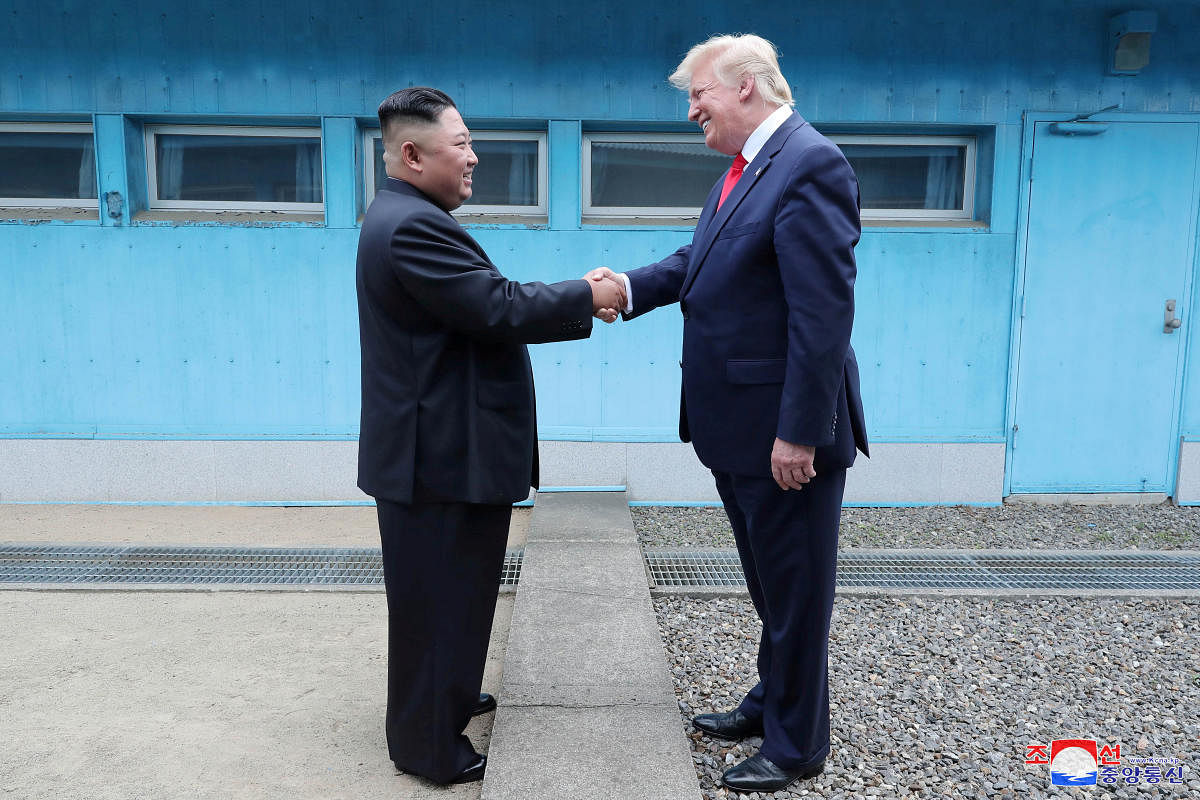U.S. President Donald Trump shakes hands with North Korean leader Kim Jong Un as they meet at the demilitarized zone separating the two Koreas, in Panmunjom, South Korea. (Reuters Photo)