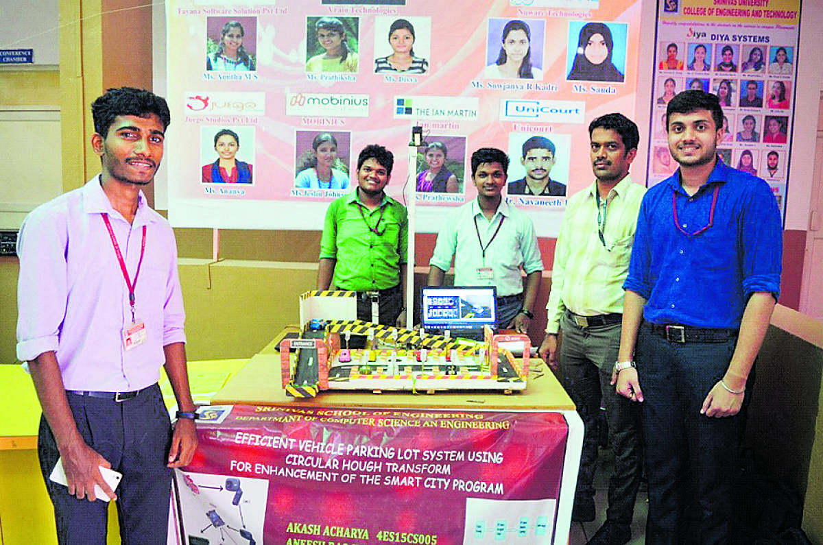 Students of Srinivas School of Engineering with their project on efficient vehicle parking lot system.