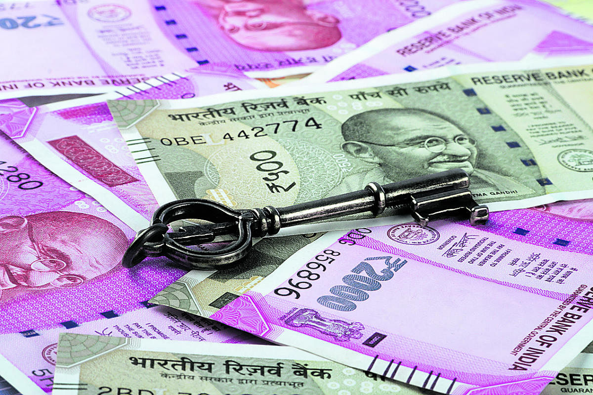 New Indian Rupees Currency with a Key. (Thinkstock Photo)