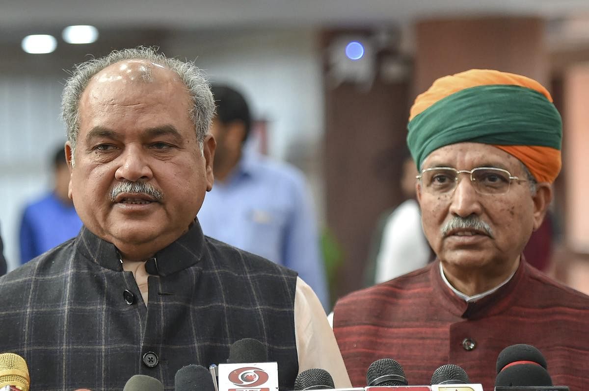 Union Agricultural Minister Narendra Singh Tomar (R). (PTI File Photo)