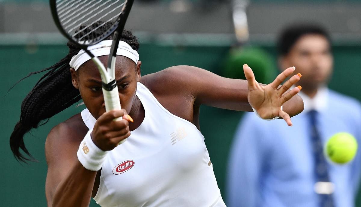 US player Cori Gauff returns the ball to US player Venus Williams during their women's singles first round match on the first day of the 2019 Wimbledon Championships. AFP