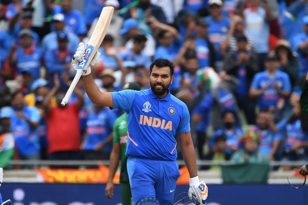 India's Rohit Sharma celebrates making his century during the 2019 Cricket World Cup group stage match between Bangladesh and India at Edgbaston in Birmingham, central England. AFP photo