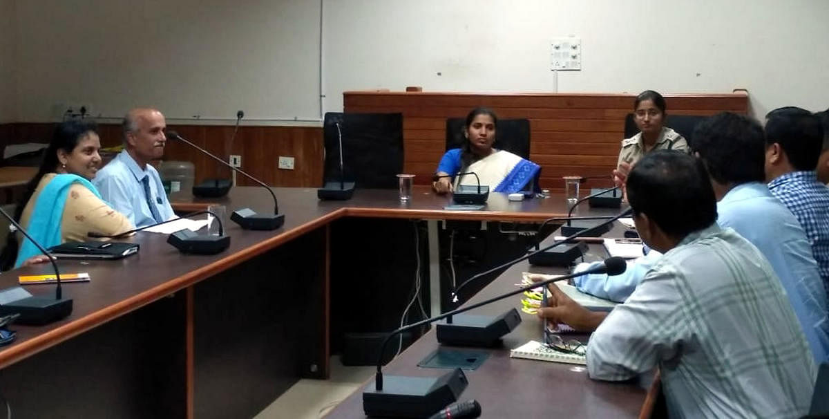 Deputy Commissioner Hephsiba Rani Korlapati chairs a meeting of government and administrative body officers in Udupi on Tuesday to discuss hassle-free traffic flow and parking areas.