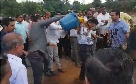 Screenshot from the video showing Nitesh Rane pouring mud over engineer.