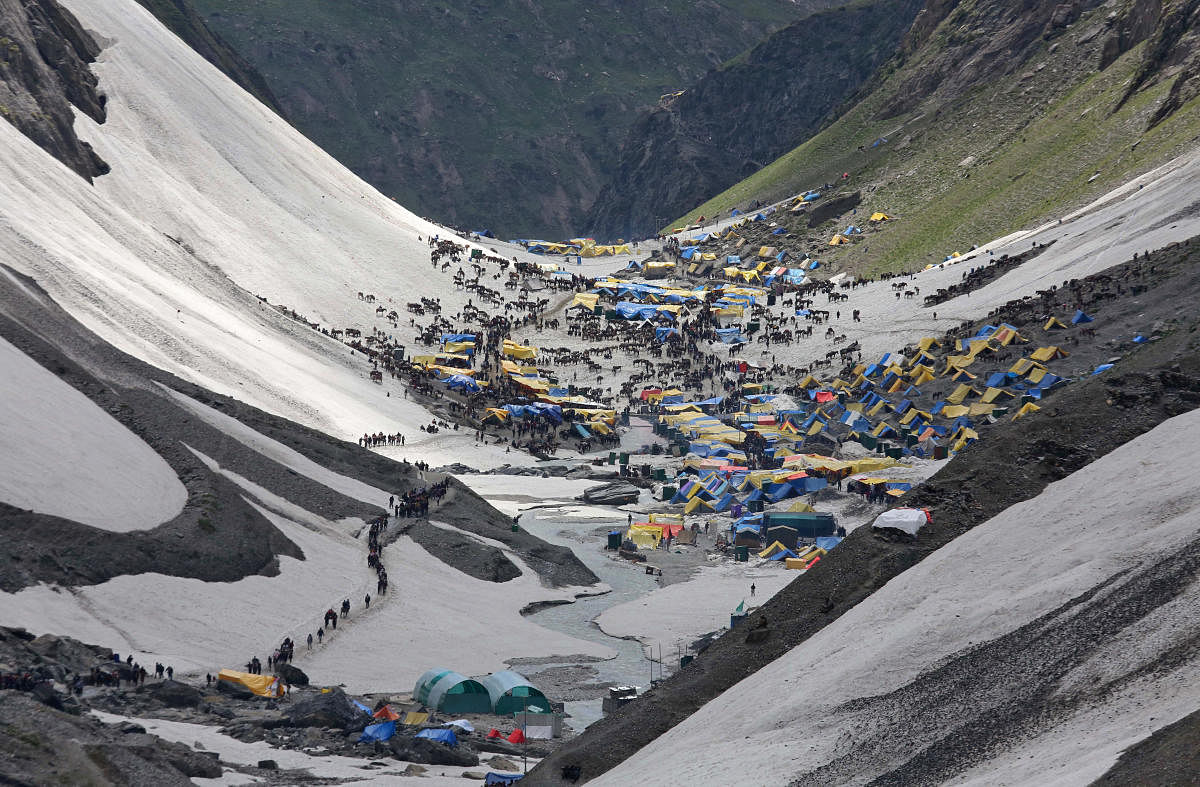Hindu pilgrims arrive to worship at the holy cave of Lord Shiva in Amarnath, southeast of Srinagar, July 2, 2019. Picture taken July 2, 2019. REUTERS