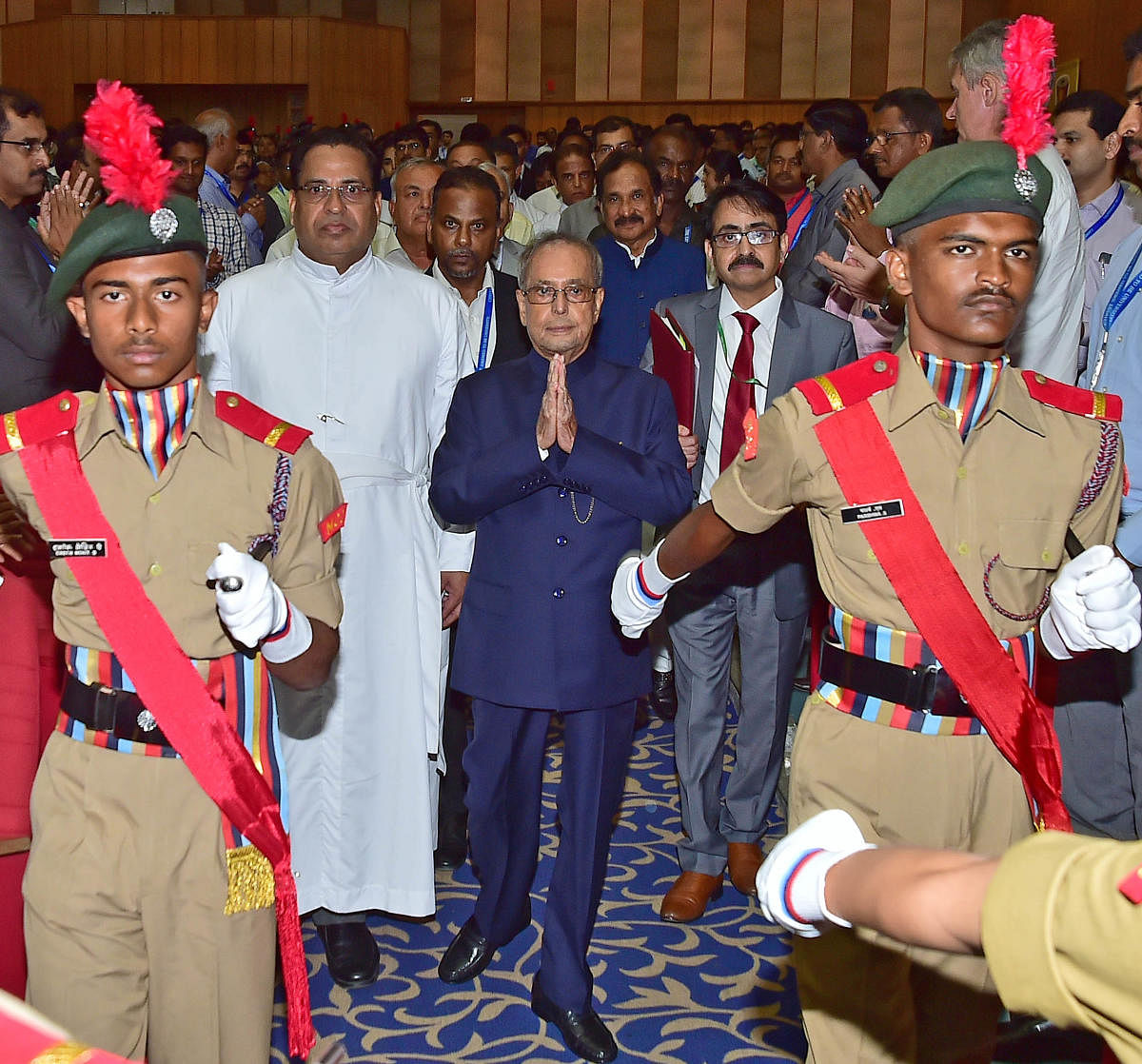 NCC students welcome former President Pranab Mukherjee at the valedictory of the golden jubilee celebrations of the Christ Deemed to be University on Thursday. DH photo/Ranju P