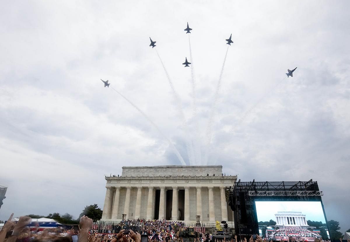As combat aircraft, including the rarely seen B2 stealth bomber flew overhead, Trump scrolled through myriad events of US history, from groundbreaking inventions to battlefield victories, drawing cheers of "USA! USA!" from an enthusiastic rain-soaked audi