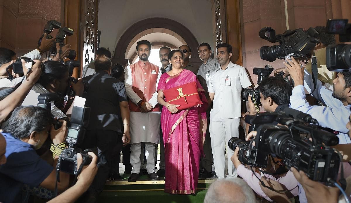 New Delhi: Finance Minister Nirmala Sitharaman and MoS Anurag Thakur arrive at Parliament to present the Union Budget 2019-20, in New Delhi, Friday, July 05, 2019. (PTI Photo/Shahbaz Khan)(PTI7_5_2019_000031B)
