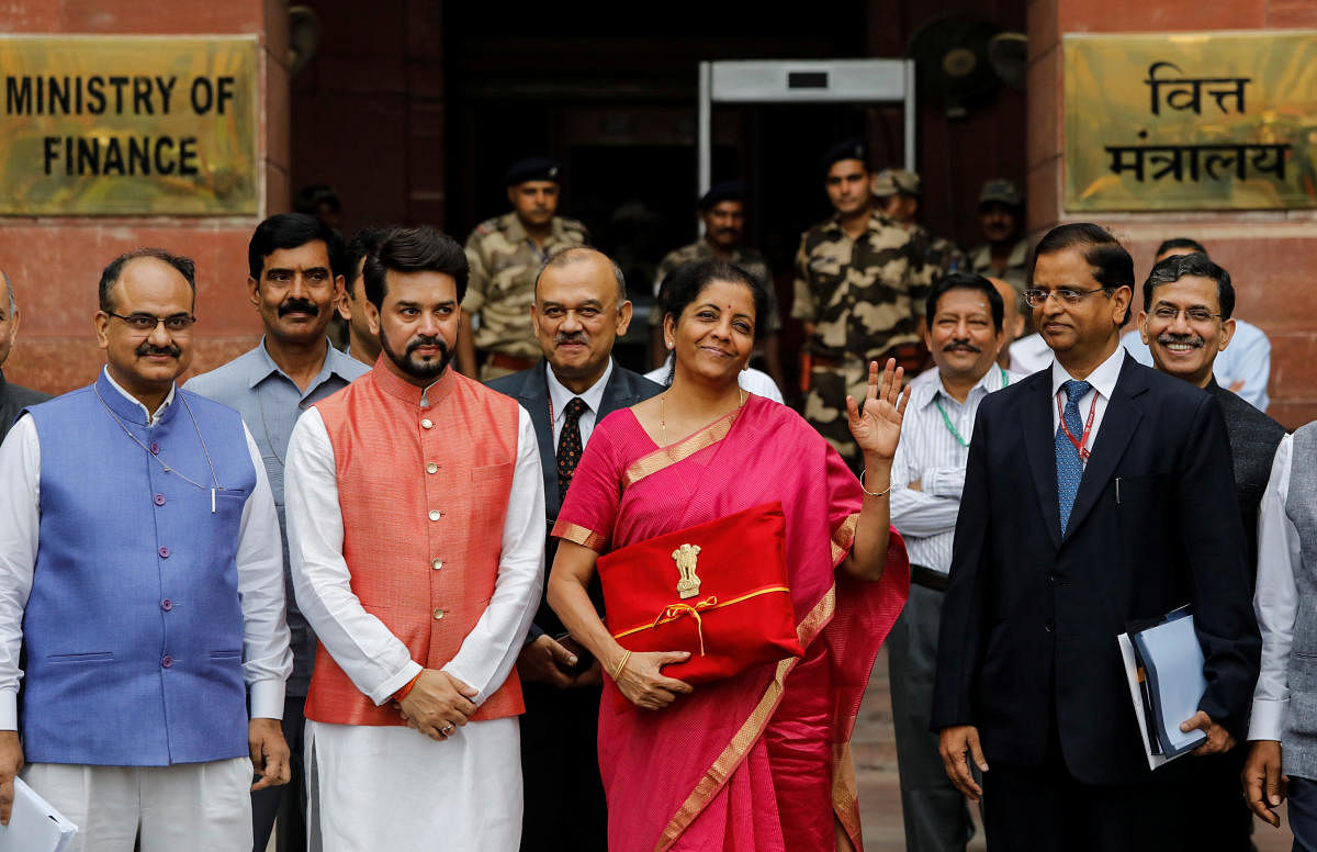 Finance Minister Nirmala Sitharaman with MoS Anurag Thakur and others outside the North Block ahead of the presentation of Union Budget 2019-20 at Parliament. PTI file photo.