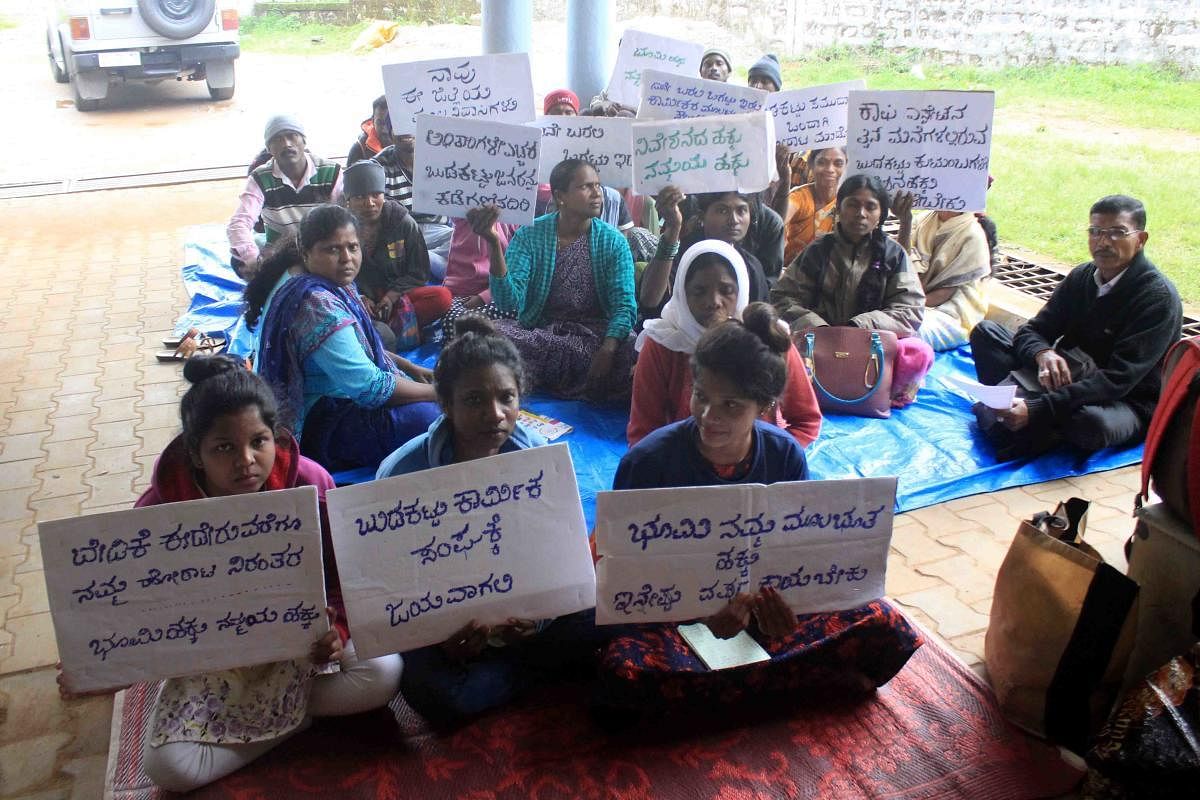 People of tribal communities staged a protest in front of ITDP office in Madikeri.