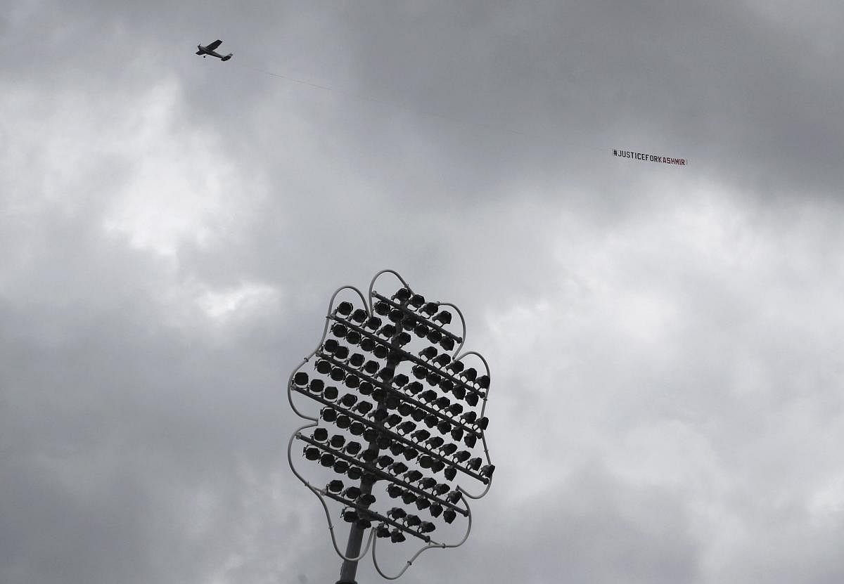 Leeds: An aircraft tows a banner which reads "Justice for Kashmir" as it flies over the venue of the Cricket World Cup match between India and Sri Lanka at Headingley in Leeds, England, Saturday, July 6, 2019. AP/PTI(AP7_6_2019_000083B)