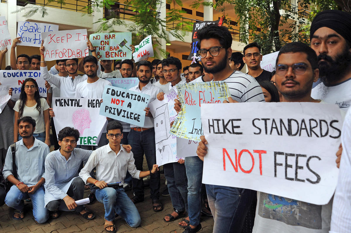 Angered by a substantial hike in college fees, the student body at the National Law School of India University Bengaluru protest to withdraw the increases on Saturday. NLSIU has hiked the fee by 25%. | DH Photo/Pushkar V