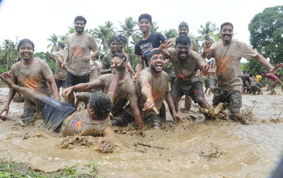People enjoying in the slush field race organised by the Ganeshotsava Samithi in Alevoor Gram Panchayat on Sunday.