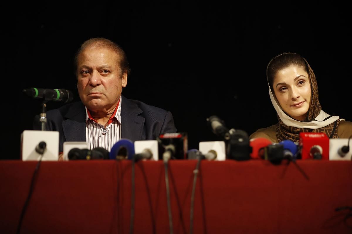 Ousted Pakistani prime minister Nawaz Sharif (L) and his daughter Maryam Nawaz (R) attend a UK PMLN Party Workers Convention meeting with supporters. (AFP File Photo)