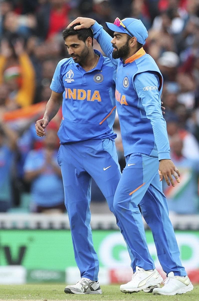 Indian pacer Bhuvneshwar Kumar (right) said proper planning helped him succeed on a flat track at The Oval against Australia on Monday. (Photo PTI)