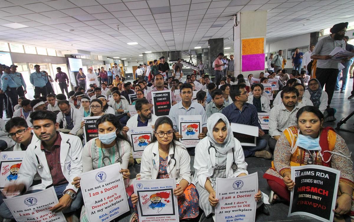 Members of the AIIMS Resident Doctors' Association (RDA) hold placards during a protest to show solidarity with their counterparts in West Bengal last month (PTI File Photo)