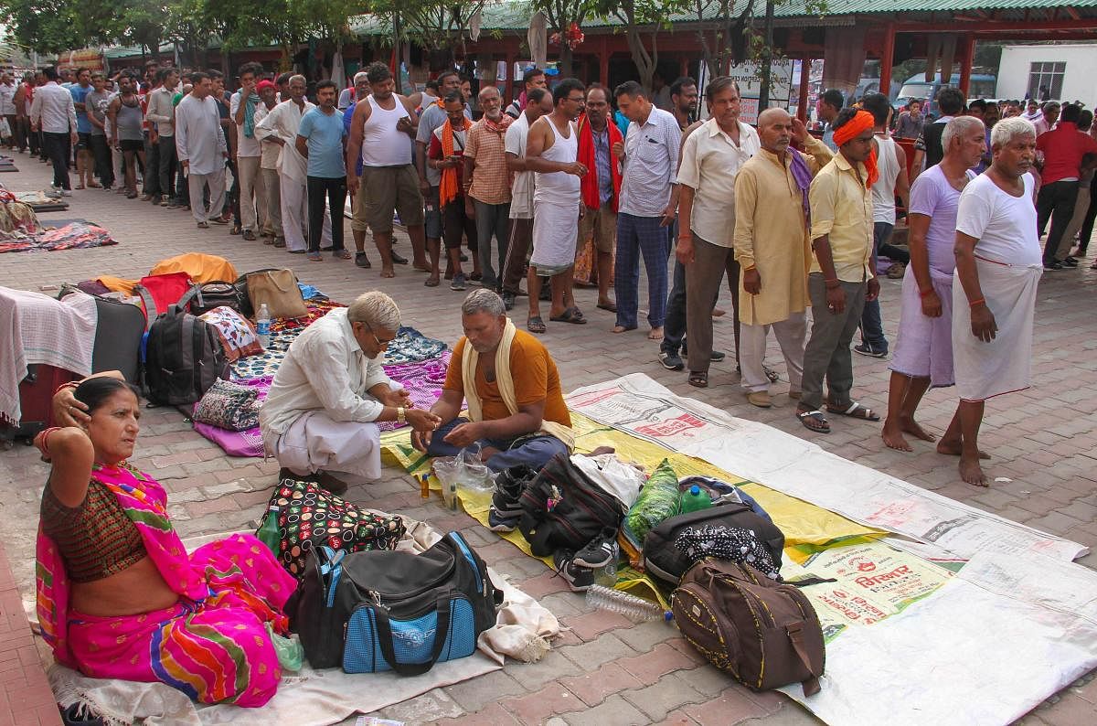 Jammu: Amarnath pilgrims at a base camp after the yatra was suspended due to the third death anniversary of former Hizbul Mujahideen commander Burhan Wani. (PTI Photo)