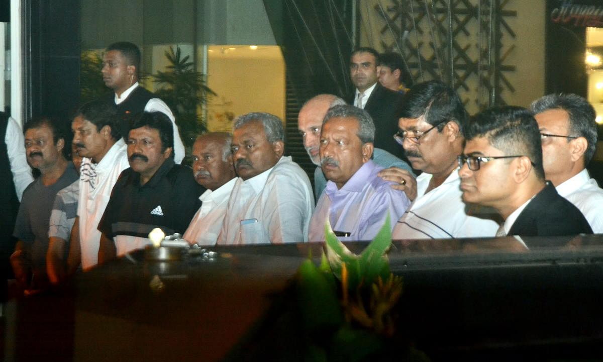 Congress MLAs from Karnataka speak to the media during their ongoing meeting with BJP leaders at a hotel in Mumbai. PTI