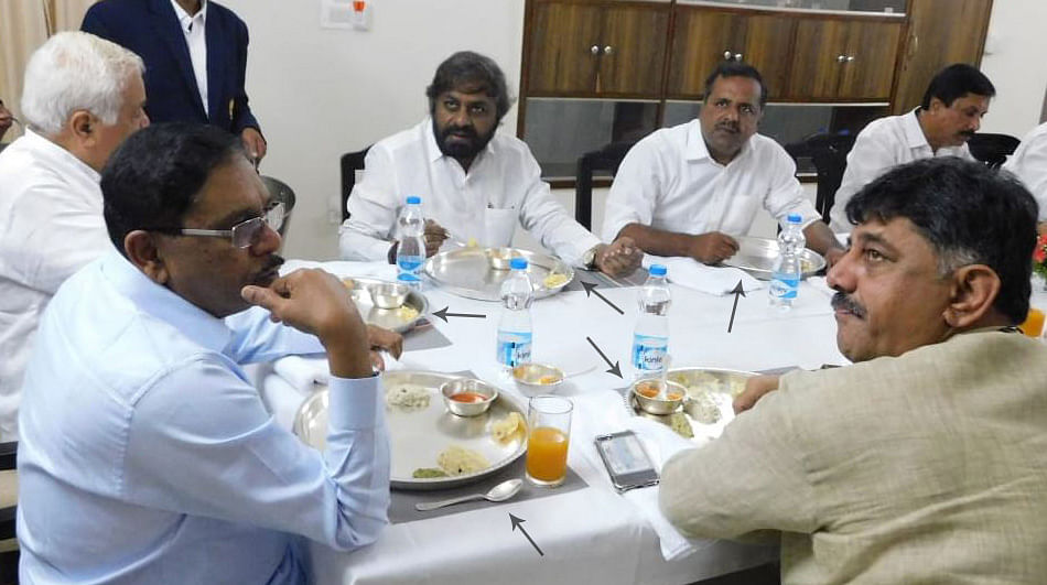 The ministers, including Deputy Chief Minister G Parameshwara and R V Deshpande, were seen relishing breakfast in "silver plates". (Pic Special Arrangement) 